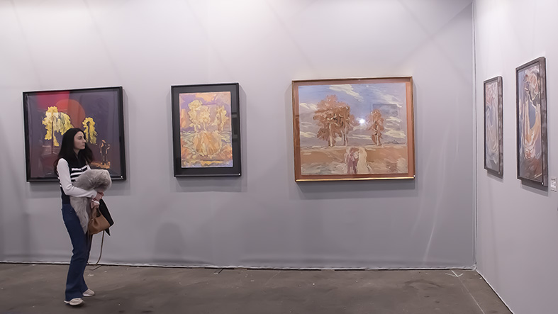 A visitor to ephemeral Grand Palais looks at the mini-exhibition of 5 works, by Nikolai Kuzmin at the Watercolour and Drawing annual exhibition (Art Capital 2024). A visitor to ephemeral Grand Palais looks at the mini-exhibition of 5 works, by Nikolai Kuzmin at the Watercolour and Drawing annual exhibition (Art Capital 2024).