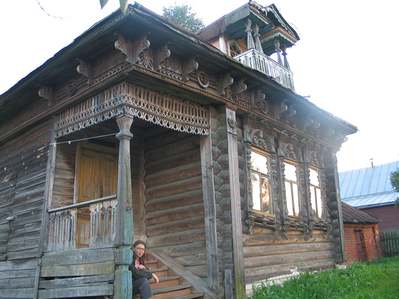 The native house of Nikolai Kuzmin in Talynskoye, not far from Nizhny Novgorod, in 2004 with his daughter Luba sitting on the porch.